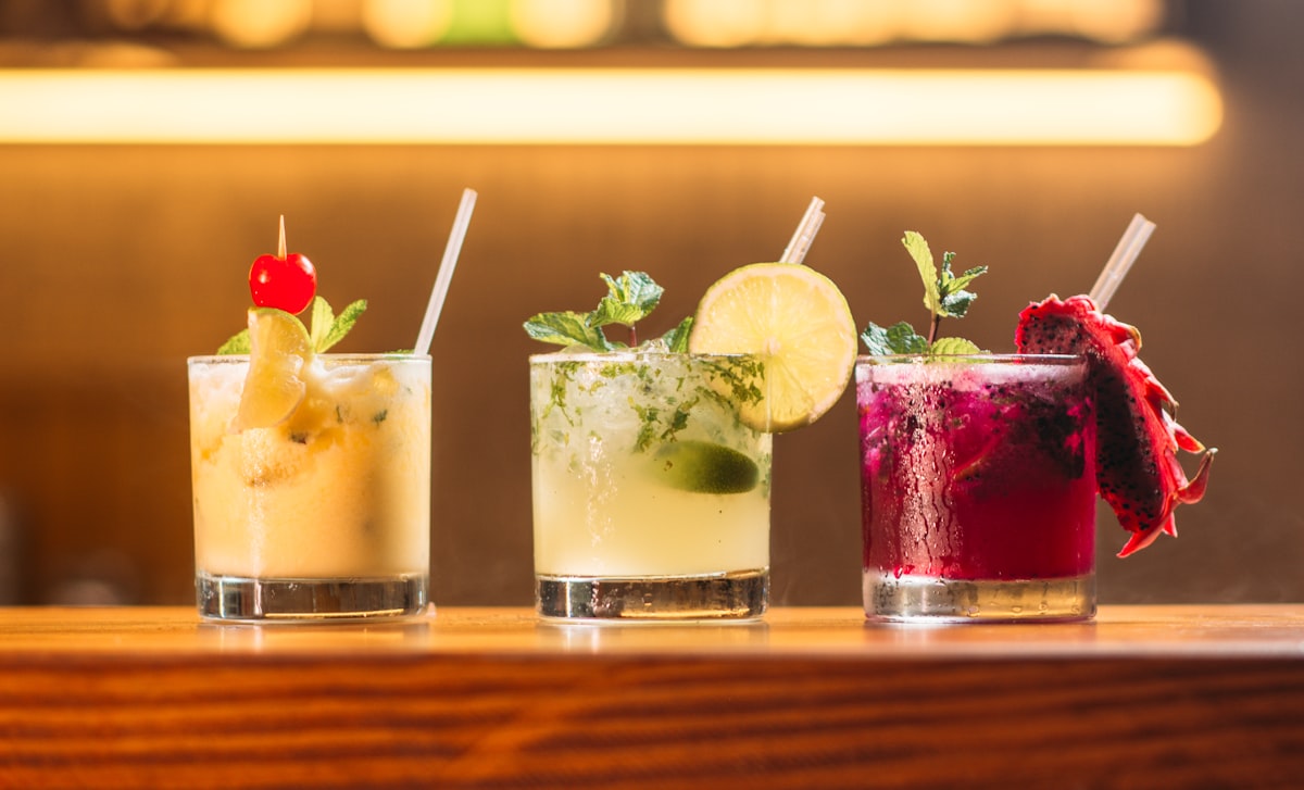 Pouring drink with fresh garnish